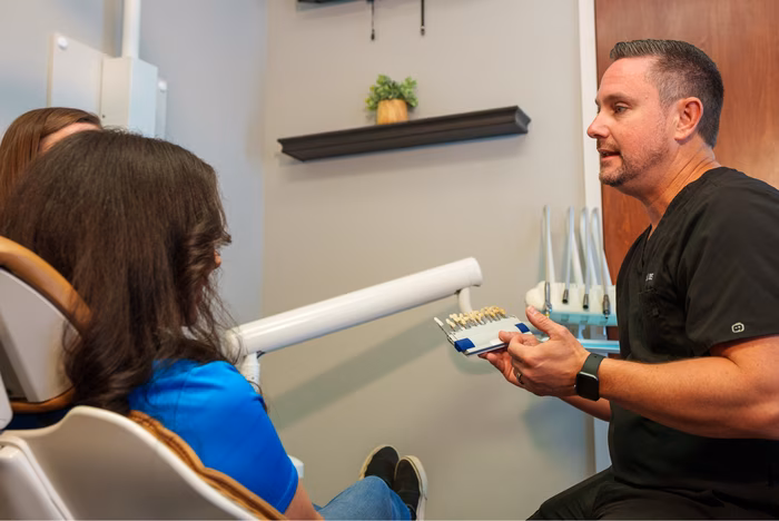 Dentist consulting with a patient about dental implants
