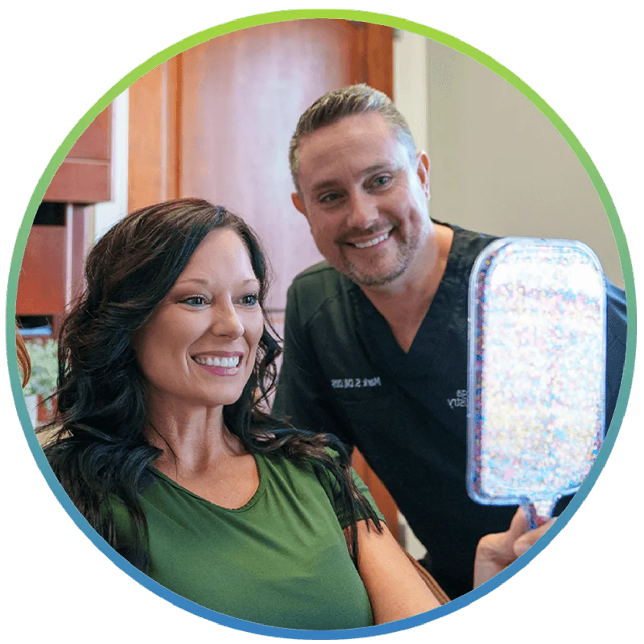 Patient and Dr. Dill reviewing teeth whitening results at Nooga Dentistry