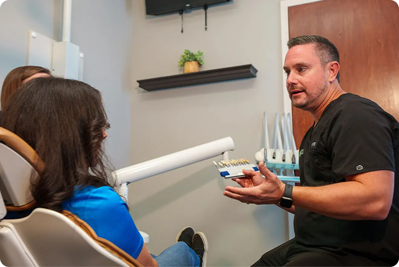 Dr. Dill consulting with a patient about porcelain veneers