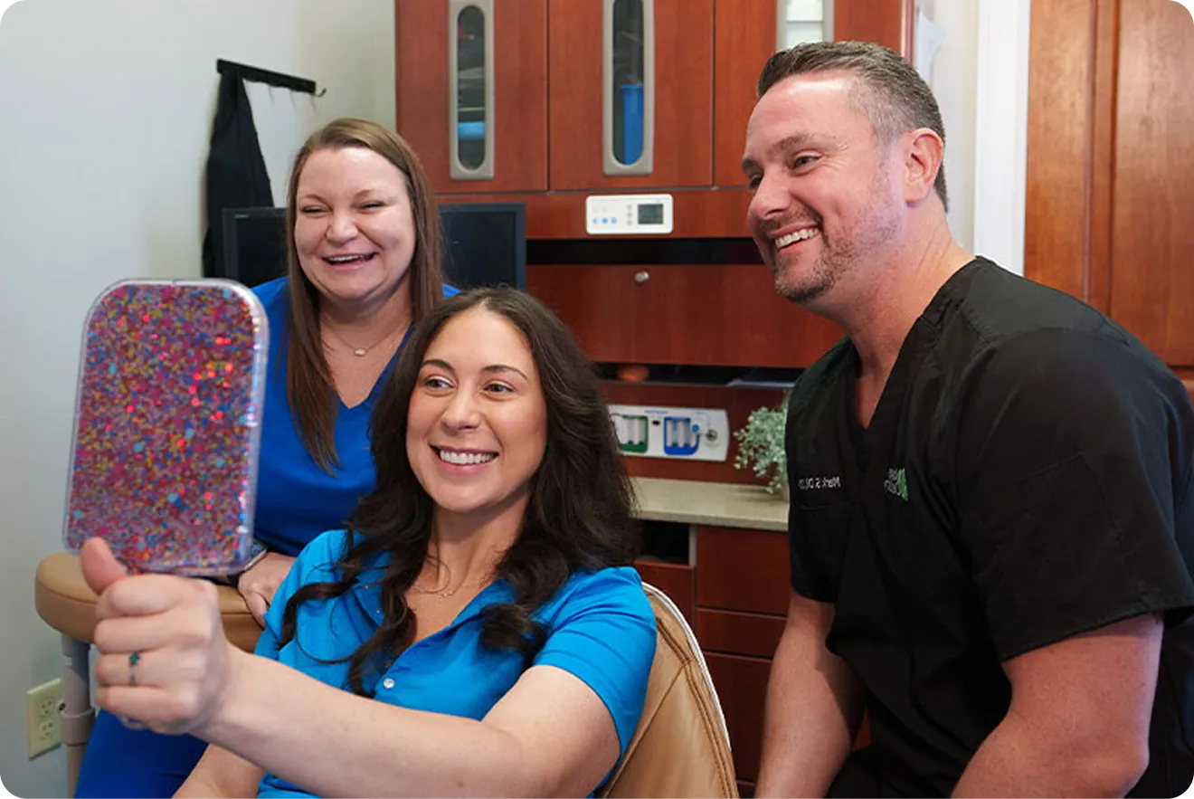 Patient smiling after successful porcelain veneer placement